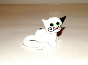 Miniature seated cat